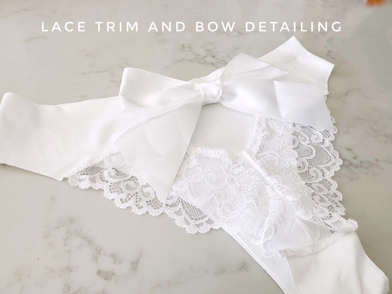 May include: White lace trim and satin bow detailing on a white garment. "Lace Trim and Bow Detailing" is written in the top left corner of the image.