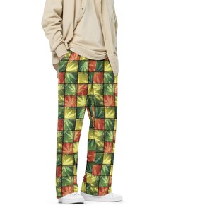 May include: A person wearing a light beige button-down shirt and green, yellow, and orange checkered pants with a leaf pattern.