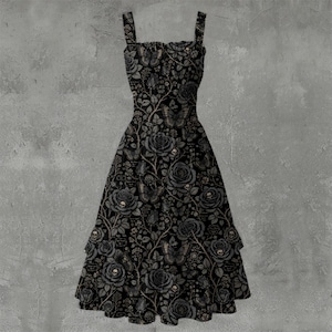 May include: A sleeveless black dress featuring a repeating pattern of grey roses, butterflies, and small skulls. The dress has a square neckline, wide shoulder straps, and a flared skirt that falls to a mid-calf length with a tiered hemline.