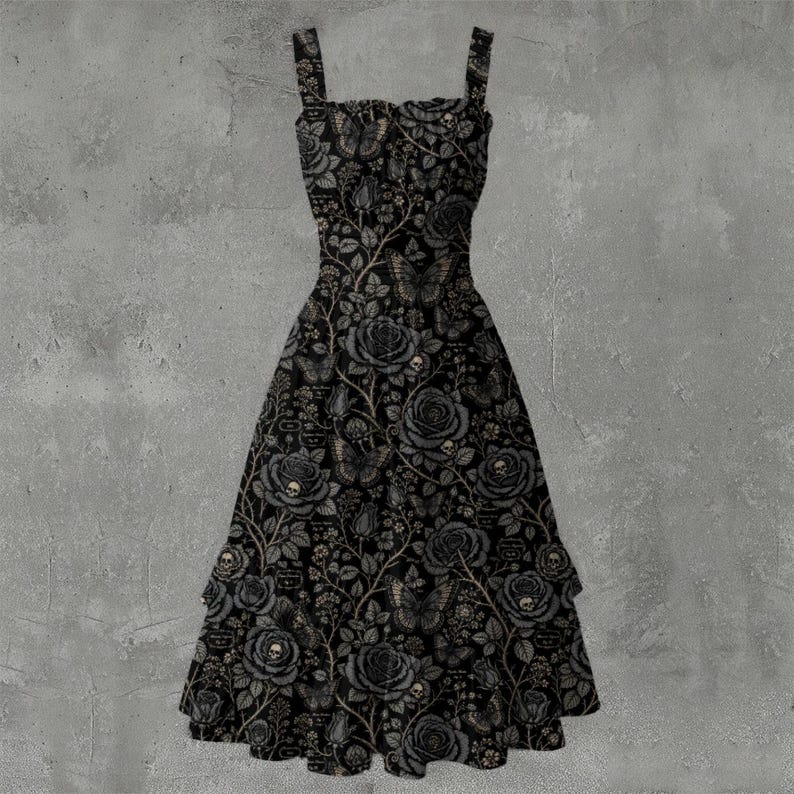 May include: A sleeveless black dress featuring a repeating pattern of grey roses, butterflies, and small skulls. The dress has a square neckline, wide shoulder straps, and a flared skirt that falls to a mid-calf length with a tiered hemline.
