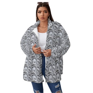 May include: A gray and white fleece jacket with a zipper closure and a pattern of dollar bills. The jacket has a sherpa lining.