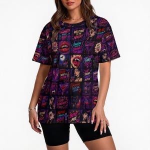 May include: A short-sleeve t-shirt featuring a grid pattern of neon-coloured graphics with vampire-themed imagery and text including "Welcome to the Night," "Dancing with the Damned," "Blood Sweat & Lipstick," "Vampire Social Club," and "Bite Me."