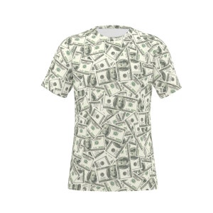 May include: A white t-shirt with a pattern of repeated images of US $100 bills. The bills are arranged in a random pattern and are slightly overlapping.