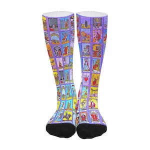 May include: A pair of knee-high socks with a colorful tarot card design on a purple background.