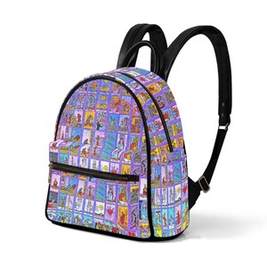 May include: A purple backpack with a black zipper and straps. The backpack is covered in a pattern of colourful tarot cards.