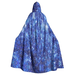 May include: A blue hooded cape with a sparkly galaxy print. The cape is made of a soft, flowing fabric.