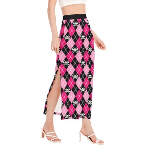 May include: A pink and black skirt with a skull and crossbones pattern. The skirt has a high waist and a side slit.