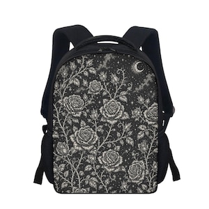 May include: A black backpack featuring a detailed white line art pattern of blooming roses, thorny stems, and leaves against a dark starry night sky background with a crescent moon. The bag includes black shoulder straps and side mesh pockets.