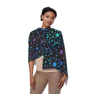 May include: A black scarf with a colorful moon and star pattern. The scarf is made of a soft, lightweight fabric and is perfect for adding a touch of whimsy to any outfit.
