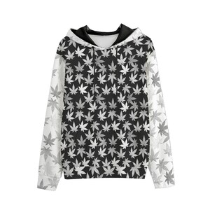 May include: A black and white hoodie with a leaf pattern. The hoodie has a hood and long sleeves.