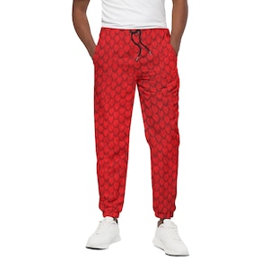 May include: Red sweatpants with a dragon scale pattern.