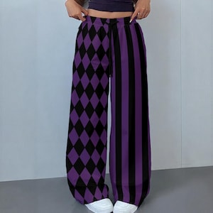 May include: High-waisted wide-leg trousers featuring a split design with a black and purple diamond pattern on the left leg and vertical black and purple stripes on the right leg, complete with a black drawstring waist and a relaxed fit silhouette.
