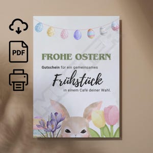 May include: An Easter-themed card with German text, including "Frohe Ostern" and "Frühstück". The design features a bunny, flowers, and painted Easter eggs hanging from a string. The card is vertical and has a light background.
