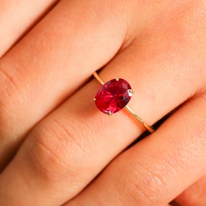 Here’s Ruby Wedding Anniversary Ring for Valentine. Our Customized Pinky Gemstone Oval Engagement Ring is use as 14K gold ruby ring for her wedding shower. 10K 14K 18K Gold Personalized Birthstone Proposal Jewelry looks like mindful Gift for her.