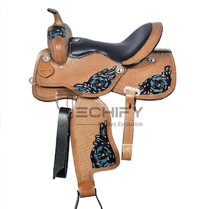 May include: A brown leather western saddle with black seat and accents. Features decorative blue and black floral designs, silver hardware, and a black stirrup. The saddle has a textured surface and is designed for horseback riding.