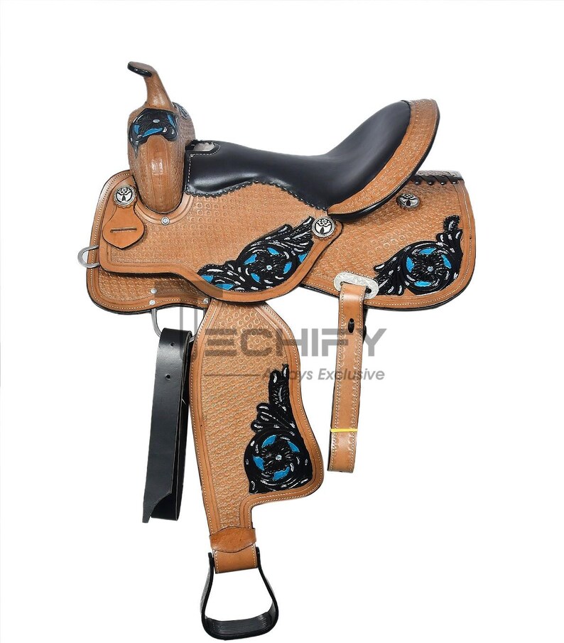 May include: A brown leather western saddle with black seat and accents. Features decorative blue and black floral designs, silver hardware, and a black stirrup. The saddle has a textured surface and is designed for horseback riding.