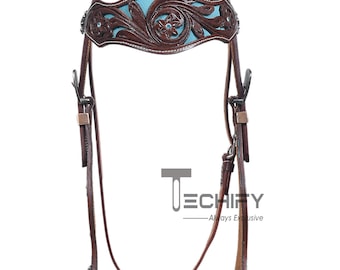 Conjunto de cabezada y petro para caballo de estilo western: cuero marrón con detalles de hojas y gamuza azul cielo.
