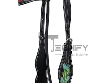 Cabezada de doma clásica de cuero hecha a mano con tallado floral y riendas.