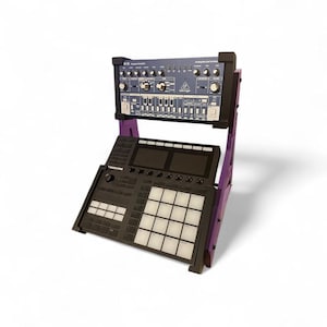 May include: A black and purple electronic music production stand holding a synthesizer and a drum machine. The synthesizer is dark blue with various knobs and buttons. The drum machine has a grid of white pads. The stand is purple.