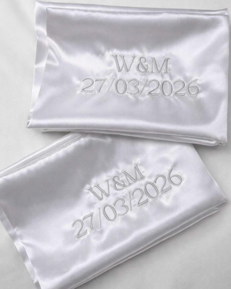 Personalized Satin Pillowcases with Embroidered Initials and Special Date  Elegant satin pillowcases customized with embroidered initials and a meaningful date. These personalized pillowcases are perfect for celebrating special moments such as weddings, engagements, anniversaries, or other memorable occasions. The soft satin fabric and delicate embroidery create a timeless and sophisticated keepsake. Soft and smooth satin fabric