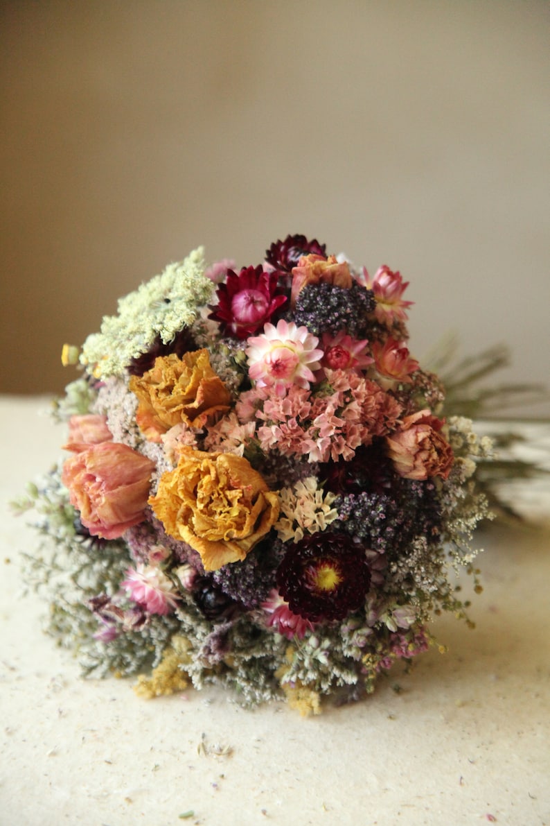Custom informational listing for Wildflower Wedding dried flower bouquets, sizes and pricing. This listing gives details regarding what is available in a custom order and how to set it up with my shop. Dried Flower Bridal and Bridesmaid Bouquets, flower girl bouquets, Boutonnieres, pocket squares, corsages, flowers crowns, hairpins and hair combs, and custom dried flower table arrangements. Contact me directly in order to set up a custom order.