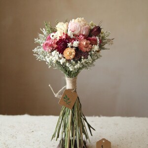 This photo features variation J of the listing. One of a kind small bridal, bridesmaid, elopement and home decor bouquet. Pale pink peony and colorful peach and pink toned strawflowers. Garden party wedding and home decor