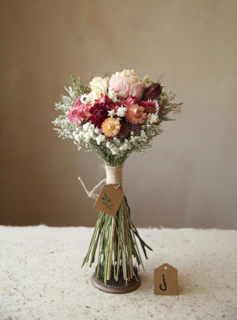 This photo features variation J of the listing. One of a kind small bridal, bridesmaid, elopement and home decor bouquet. Pale pink peony and colorful peach and pink toned strawflowers. Garden party wedding and home decor