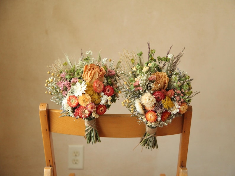 Autumnal inspired chair bouquets. Wedding aisle floral decor. Mix of dried peonies, strawflowers, gypsophila, ammobium, gomphrena, caspia, yarrow and wild grasses. Fully customized wedding decor. Organically and sustainably grown.