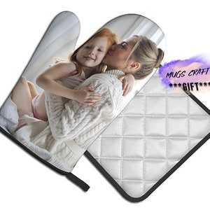 May include: A white oven glove and pot holder set featuring a photograph of a mother and daughter embracing. The image is printed on both the glove and the pot holder. The pot holder has a quilted design.