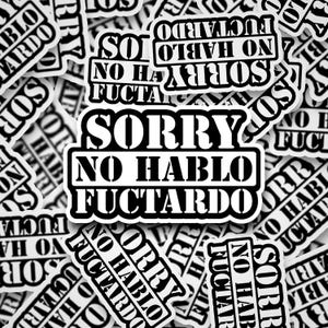 May include: A collection of white stickers with black text. The stickers feature the phrase "SORRY NO HABLO FUCTARDO" in a bold, sans-serif font. The stickers are rectangular with rounded corners.