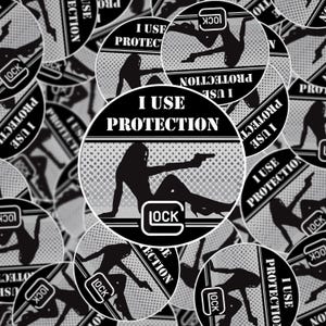 May include: A collection of black and white stickers featuring a silhouette of a person holding a handgun. The stickers have the text "I USE PROTECTION" and the "LOCK" logo. The background has a dotted pattern.