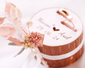 Wooden log wedding ring holder engraved with the first names of the bride and groom