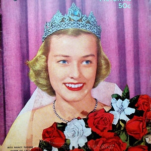 May include: A vintage magazine cover featuring a woman wearing a tiara and a white gown, holding a bouquet of red roses and white flowers. The cover reads "Pasadena Tournament of Roses Pictorial 50c" and "Miss Nancy Thorne Queen of 1952".