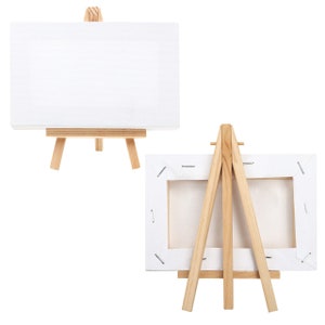 Wood Easels Or Painting Art Boards With White Canvas Of Different