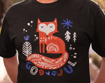 May include: A black t-shirt with a red fox illustration and the text "God Jul" in blue and white.