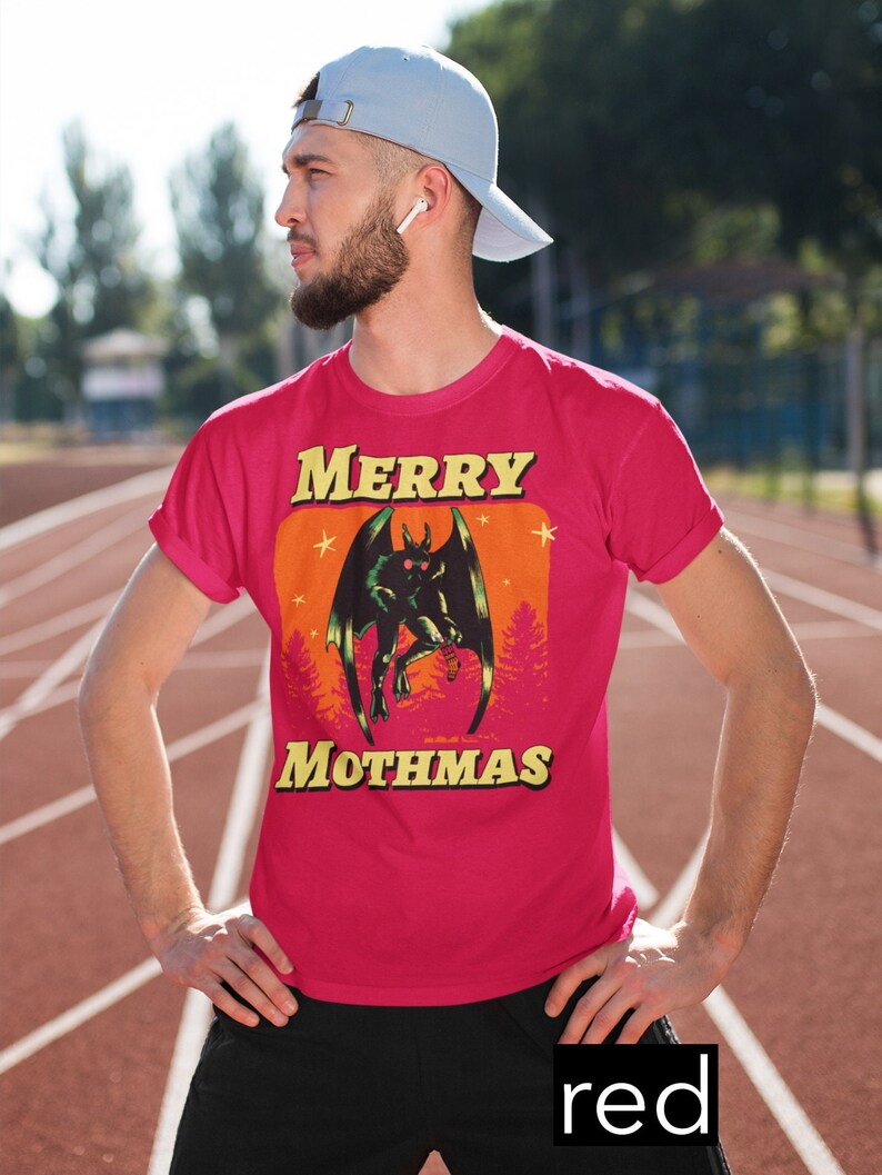 May include: A red t-shirt with a graphic of a monster with the text "MERRY MOTHMAS" printed on it.