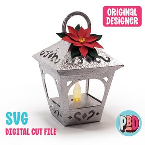 May include: A silver lantern with a poinsettia flower on top and a battery-operated candle inside. The lantern has decorative cutouts and a handle. Text on the image reads "SVG DIGITAL CUT FILE" and "ORIGINAL DESIGNER".