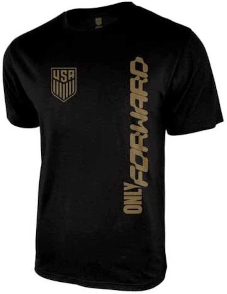 May include: Black t-shirt with a gold graphic of the USA flag and the text "ONLY FORWARD" on the right side.