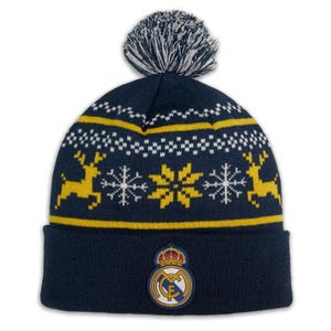 May include: Navy blue knit beanie with a white and yellow snowflake and reindeer pattern. The hat features a white and navy pom-pom and a team logo patch on the front. A winter hat for cold weather.