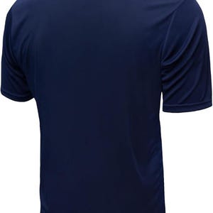 May include: A short-sleeved navy blue t-shirt featuring a solid dark blue body and a contrasting bright red crew neckline. The garment is constructed from a smooth, lightweight fabric and is shown from a rear-facing perspective, displaying the plain back.