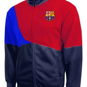 May include: A red, blue, and navy blue zippered jacket with the FC Barcelona logo on the chest.