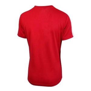 May include: Red short-sleeved t-shirt with white trim on the sleeves.