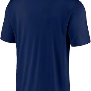 May include: A navy blue polo shirt with short sleeves and a white embroidered logo on the back that reads "ONE NATION. ONE TEAM."