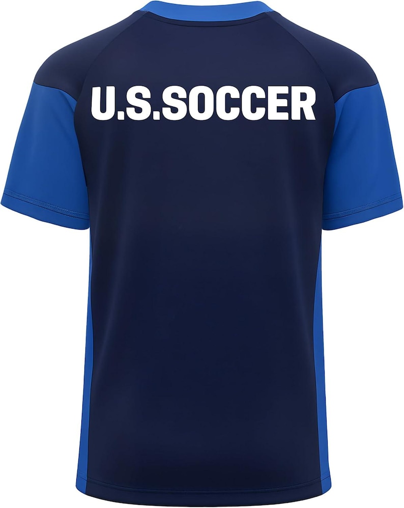 May include: Navy blue and royal blue soccer jersey with the text "U.S. SOCCER" in white block letters across the back. The jersey has short sleeves and a crew neck. The sleeves and side panels are royal blue.