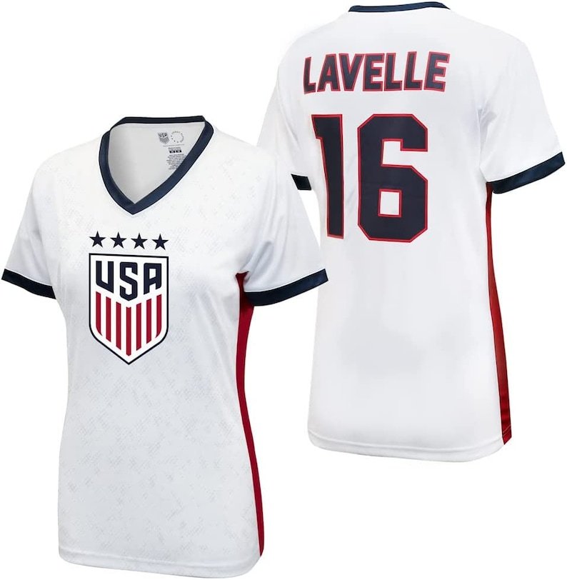 May include: White soccer jersey with red and navy blue trim. The jersey has the USA crest on the front and the name "Lavelle" and the number "16" on the back.