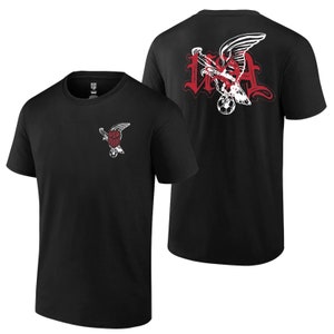 May include: Two black t-shirts with a graphic of a bald eagle holding a soccer ball. The eagle is in a white and red color scheme. The text "USA" is on the back of one shirt.