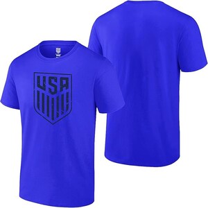 May include: Two royal blue t-shirts, one with a distressed navy blue USA graphic on the front, and the other plain.