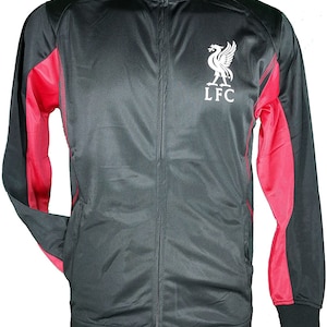 May include: Black and red zip-up jacket with a white Liverpool Football Club logo and the letters "LFC" on the front.