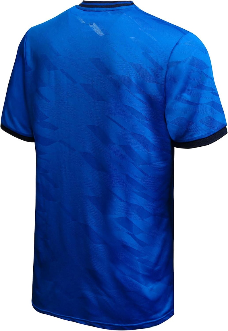 May include: A royal blue athletic jersey with a geometric pattern. The short-sleeved shirt has a crew neck and black trim on the collar and sleeves. The back of the shirt is visible in the image.