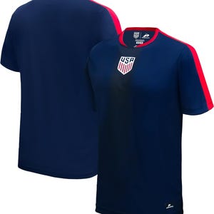 May include: Navy blue short-sleeve athletic shirt with red accents on the shoulders and neckline. The shirt features the USA logo on the chest. The shirt is made of a breathable, moisture-wicking fabric, suitable for sports and training.